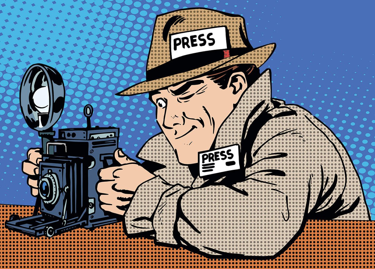 Picture of a sly journalist with a big camera