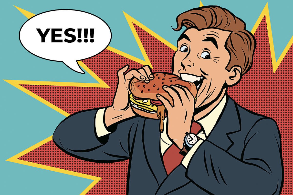 Business man eating delicious burger