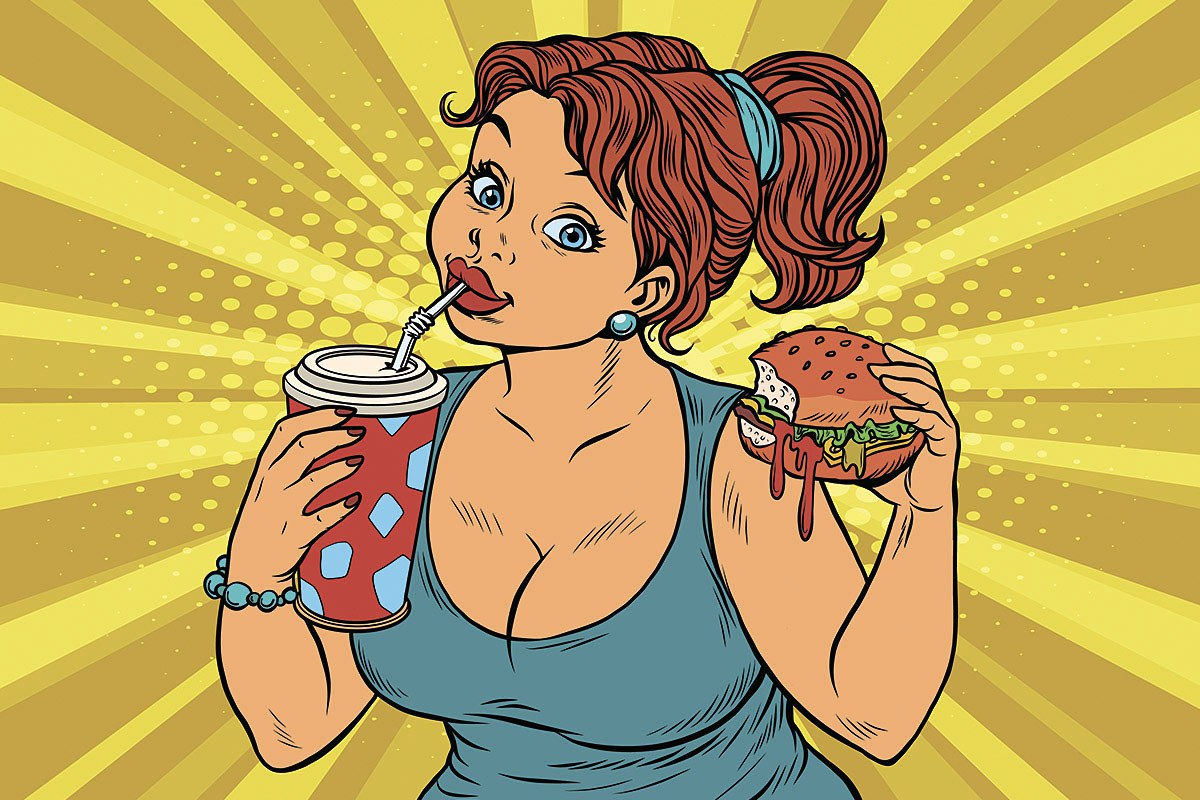 Picture of a woman with a glass of sparkling water and a burger in her hands