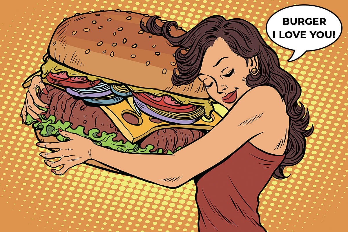 Pretty woman with huge burger in her hands