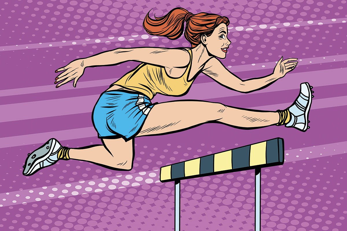 Picture of an athletic woman jumping over barriers