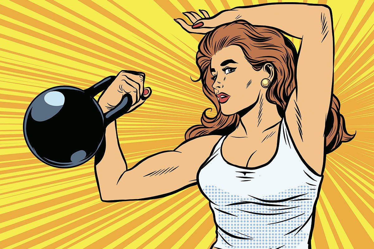 Strong athletic woman with a big kettlebell in her hand
