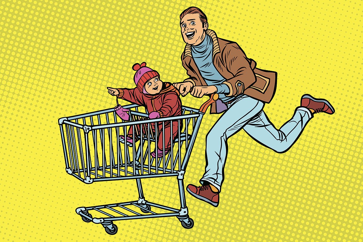 Picture of a father running with a grocery cart in which his child