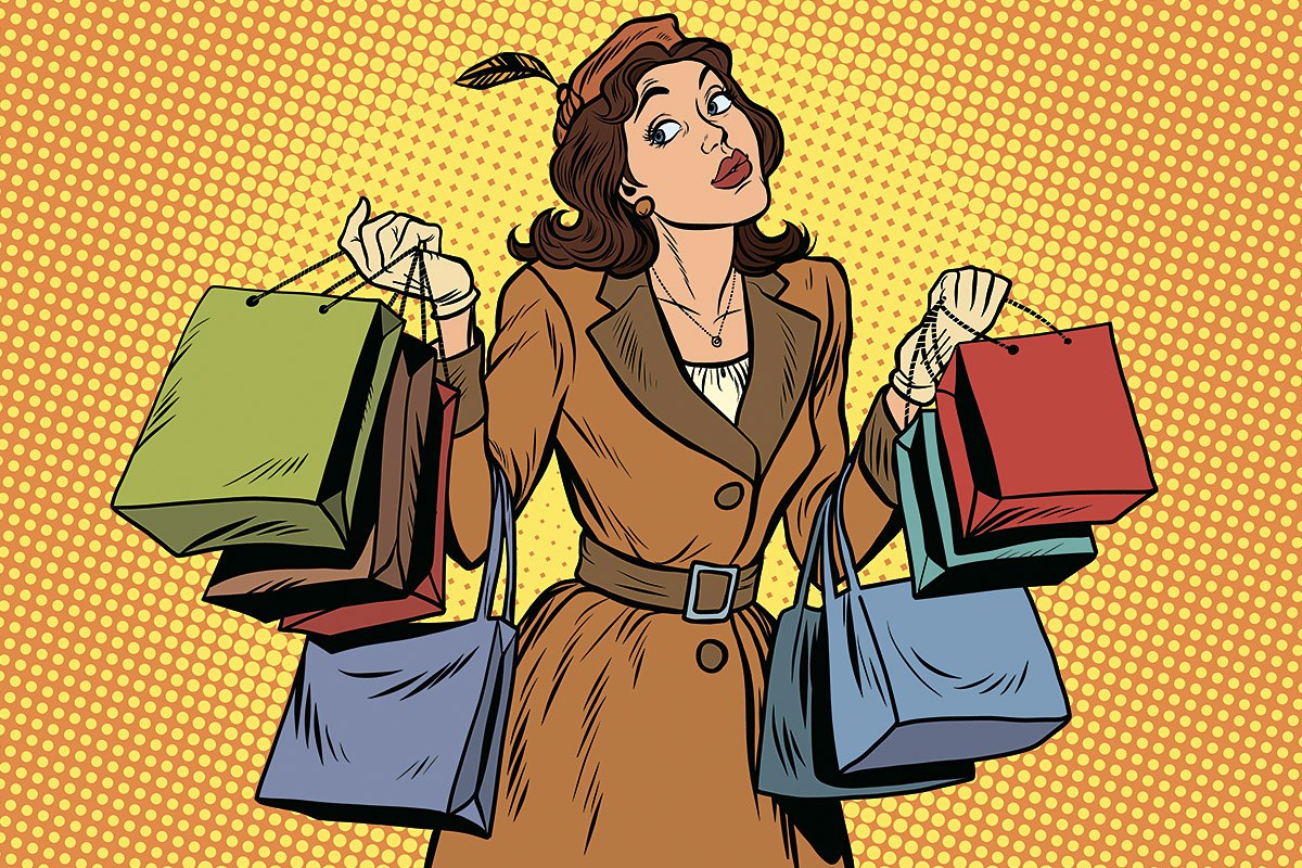 Picture of an attractive woman with many purchases in her hands