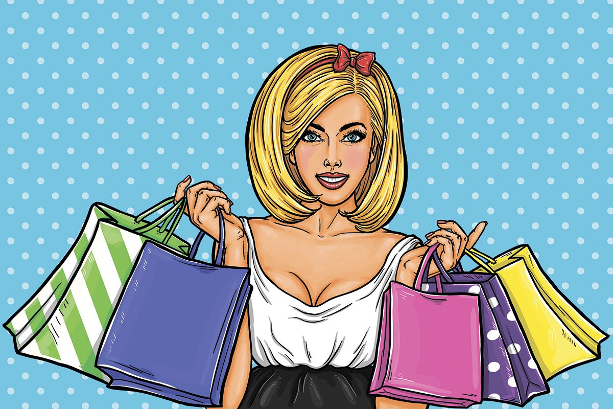 Joyful girl with many shopping bags