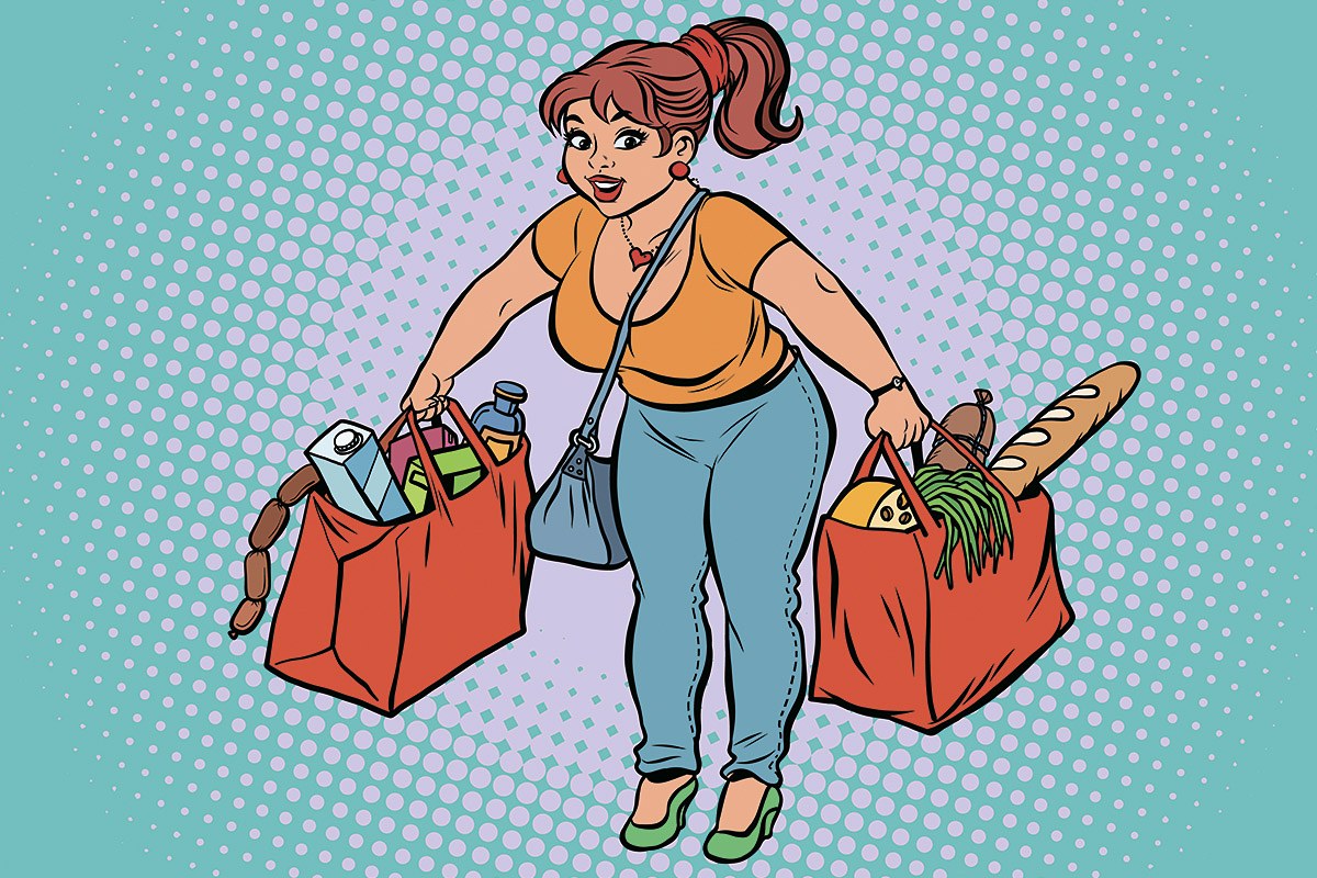 Picture of a tired woman with large bags of groceries in her hands