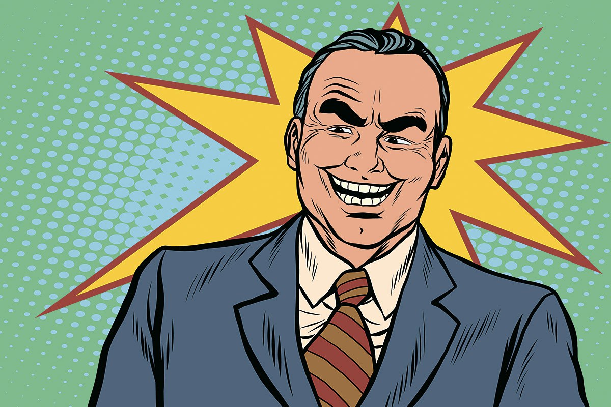 A man in a business suit smiles slyly