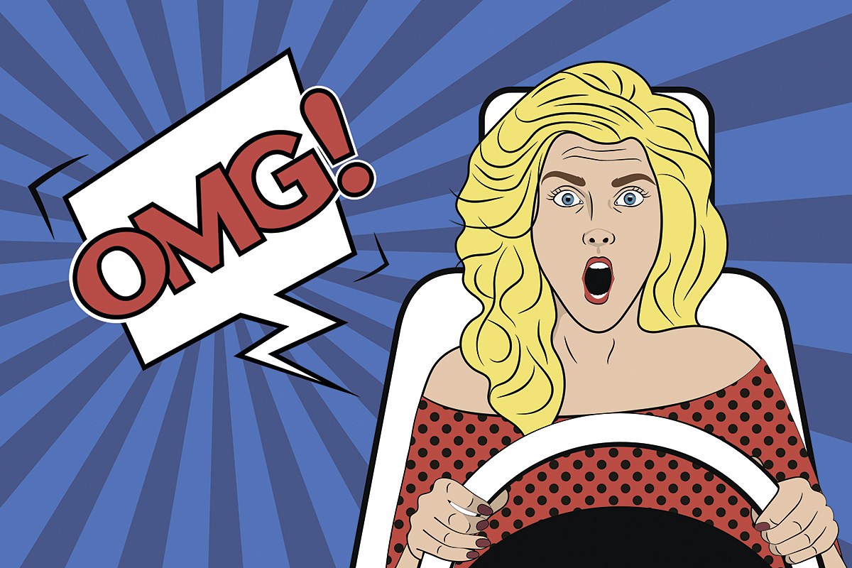 Picture of a surprised girl driving a car