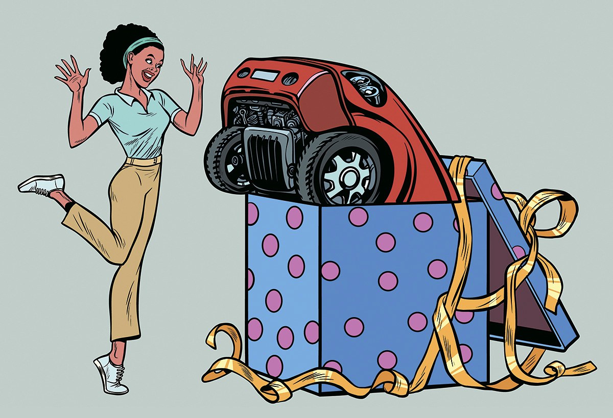 Joyful girl with a presented car