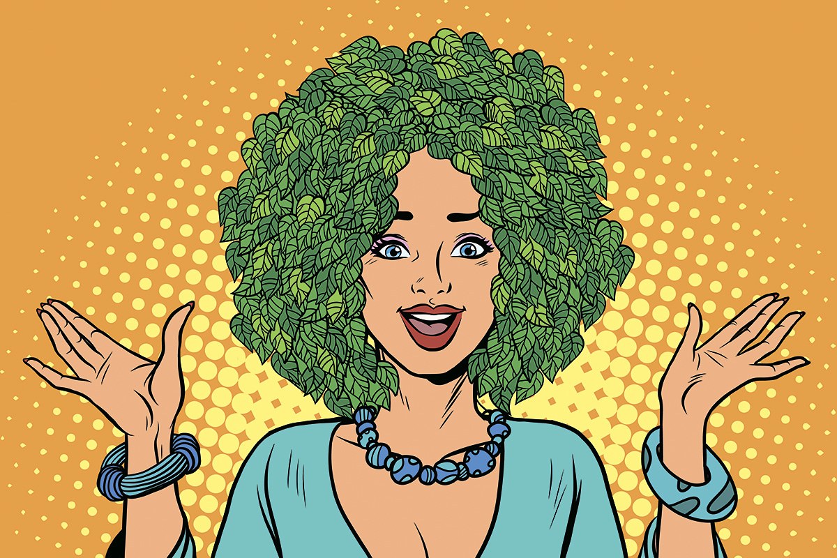 Picture of a cute woman with a hat on her head made of green leaves