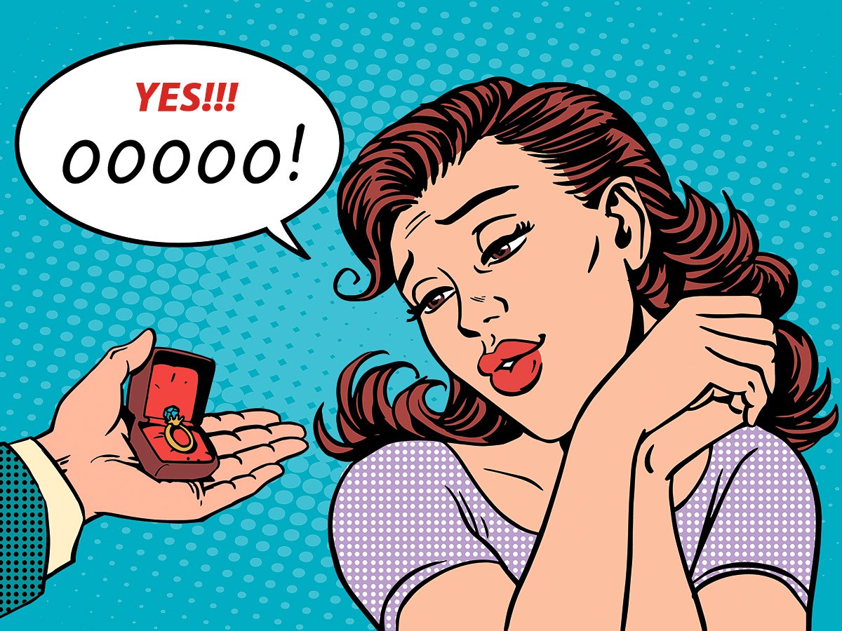 Delightful woman receives a gold ring as a gift