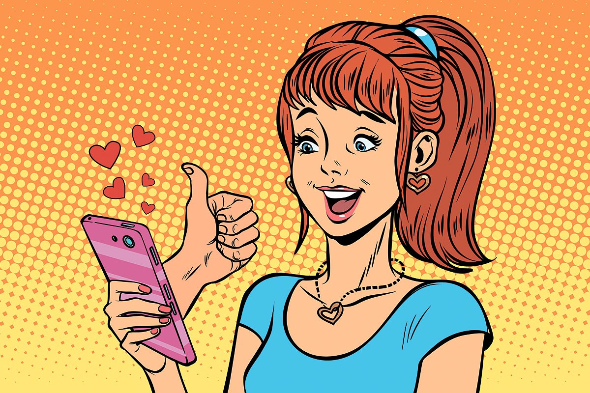 Cheerful girl with a pink mobile phone in her hands