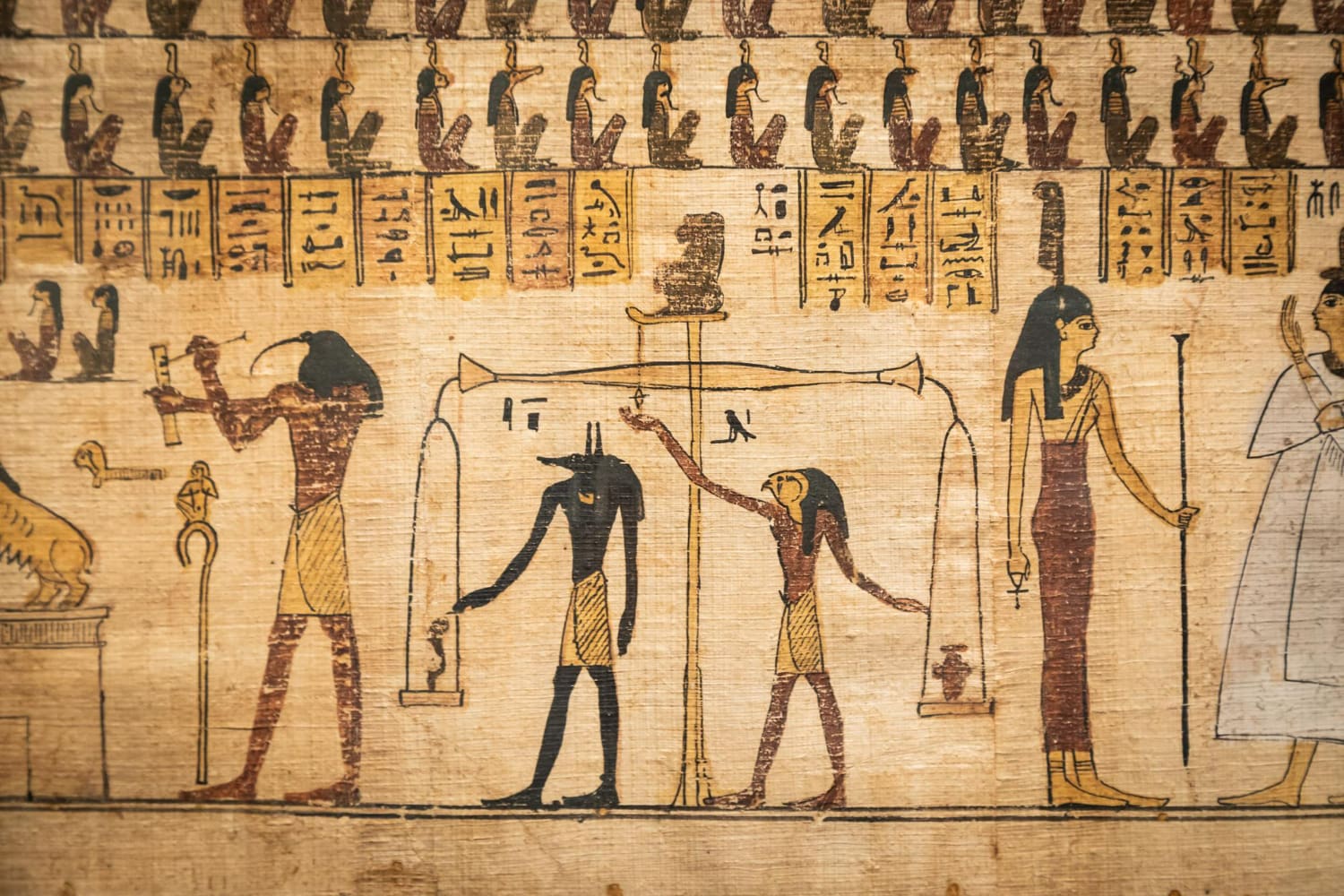 Repetitive row of identical serpent heads (cobra symbols/uraeus) representing protective divine forces.